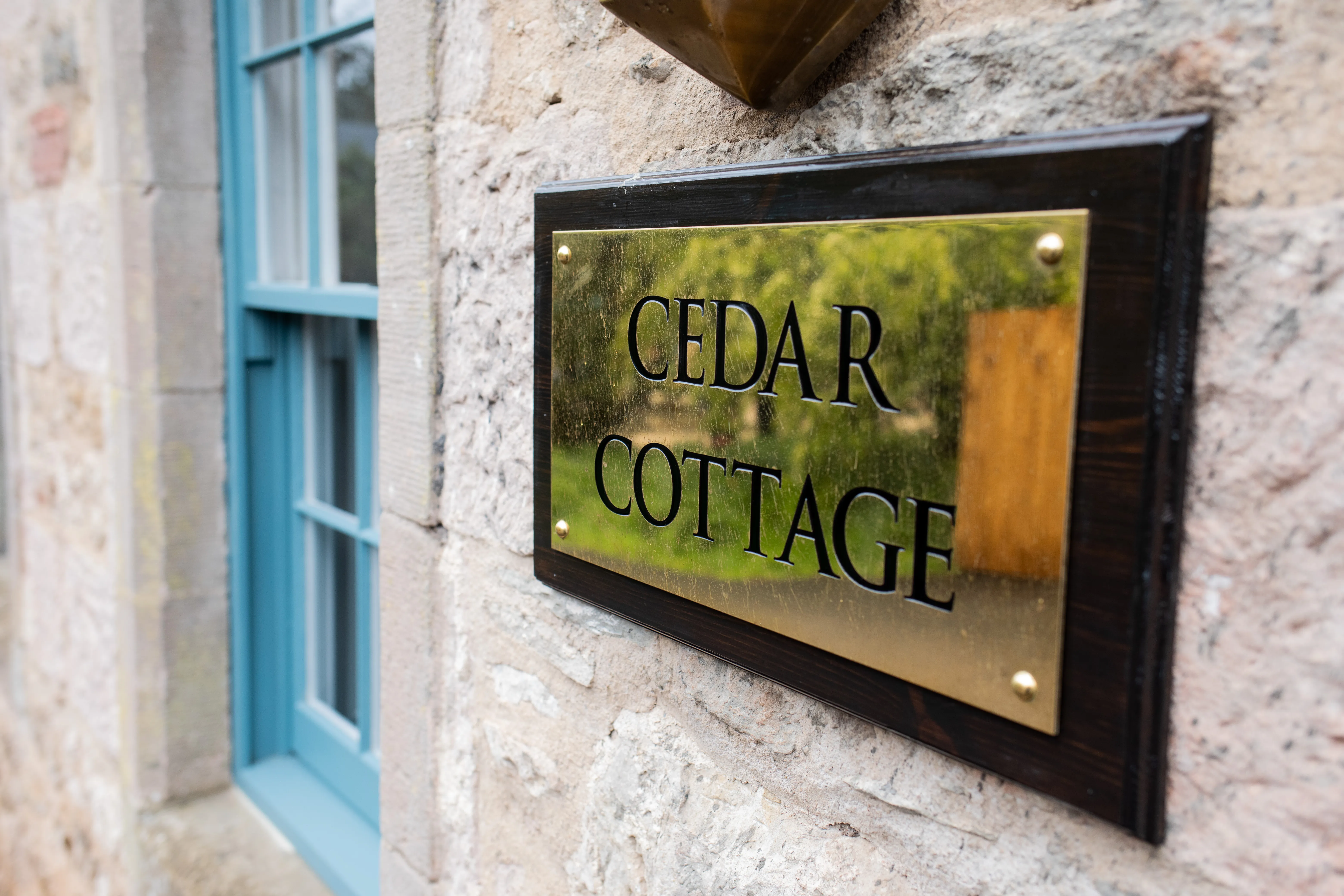 Cedar Cottage nameplate at Broxmouth Courtyard.