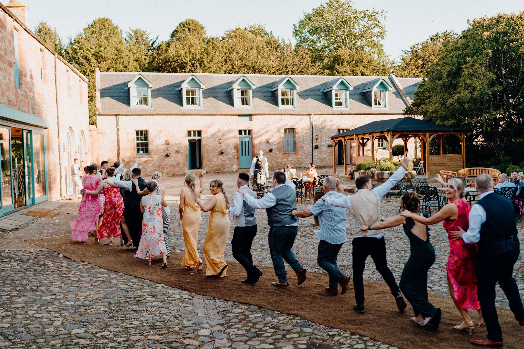 The Courtyard image conga line celebration.